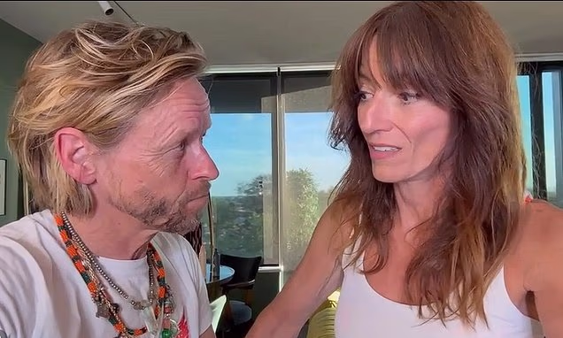 Davina McCall and her husband Michael Douglas pose together on a red carpet