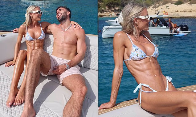 Molly Smith wearing a blue bikini alongside Tom Clare in Mallorca