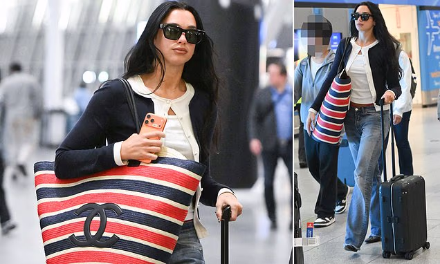 Dua Lipa stepping out in New York City carrying a large Chanel handbag