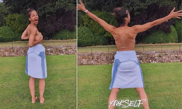 Julia Bradbury posing outdoors in her garden for an empowering photo shoot.