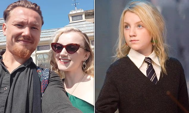 Evanna Lynch attending a red carpet event smiling
