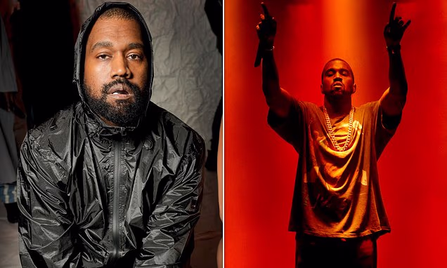 Kanye West illuminated on stage during a concert performance