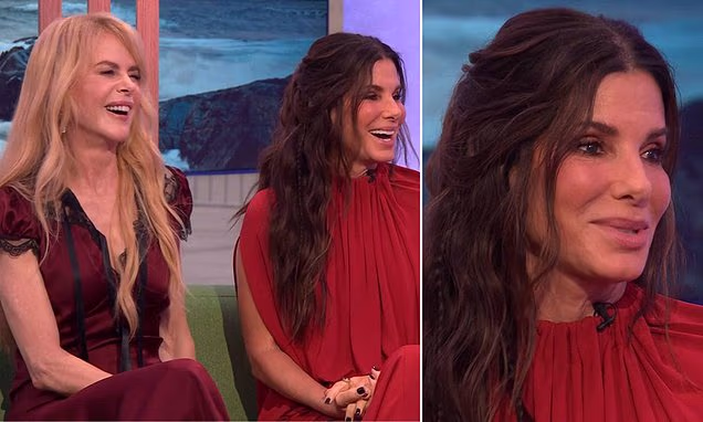 Sandra Bullock and Nicole Kidman laughing together during a live television interview.