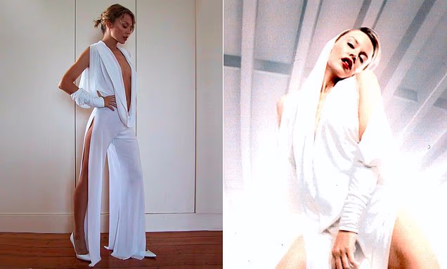 Kylie Minogue wearing her iconic white hooded jumpsuit in a throwback photo