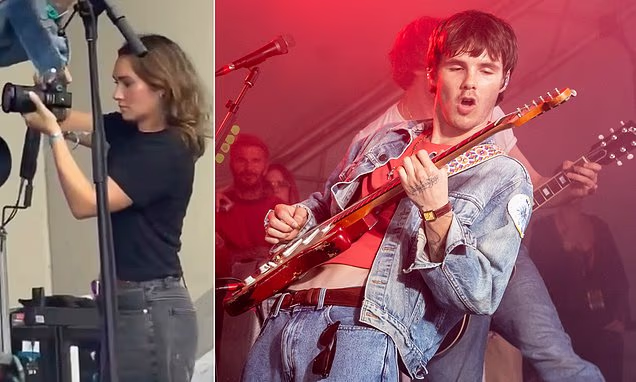Cruz Beckham performing on stage while his cousin Libby Adams photographs the concert at Reading Festival.