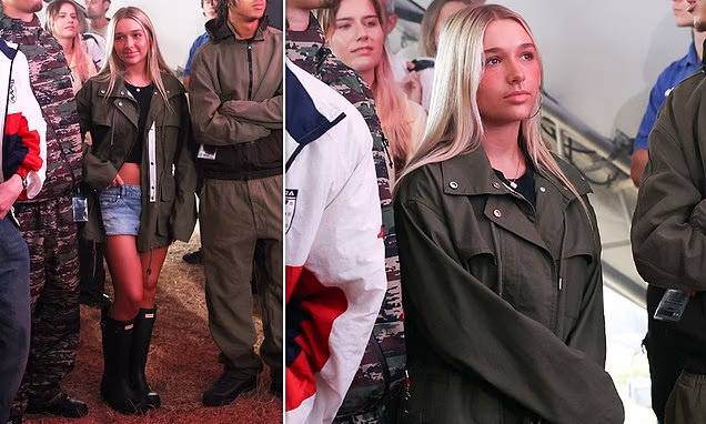 Harper Beckham attending Reading Festival wearing denim shorts and a Victoria Beckham GAP jacket.