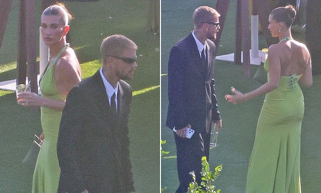Justin and Hailey Bieber attending an event dressed in stylish evening attire