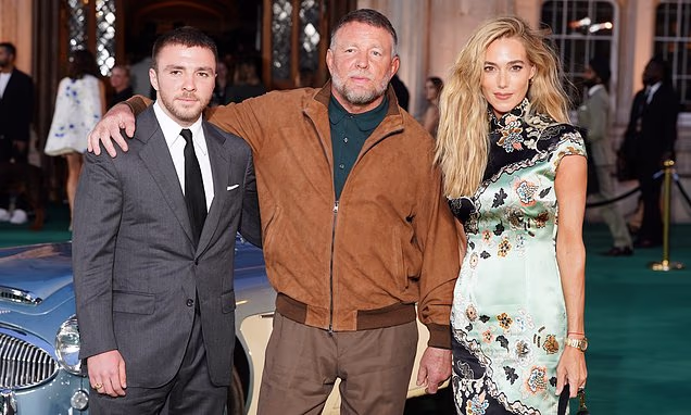 Guy Ritchie posing with wife Jacqui Ainsley and son Rocco at the premiere of The Gentlemen season two.