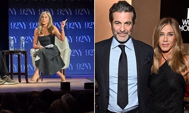 Jennifer Aniston smiling during a live interview in New York City
