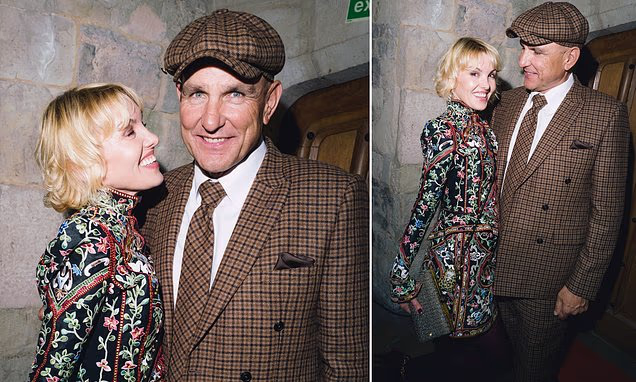 Vinnie Jones and girlfriend Emma Ford look loved up at a event