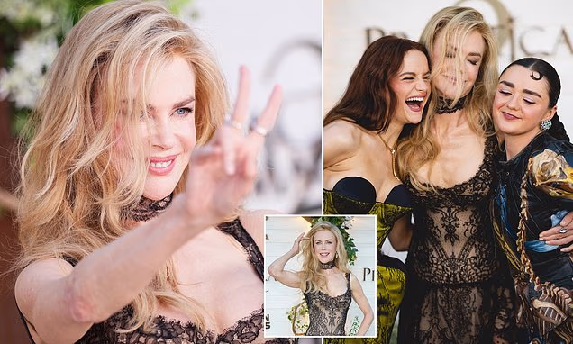 Nicole Kidman posing playfully on the red carpet at the Practical Magic 2 premiere in Los Angeles.