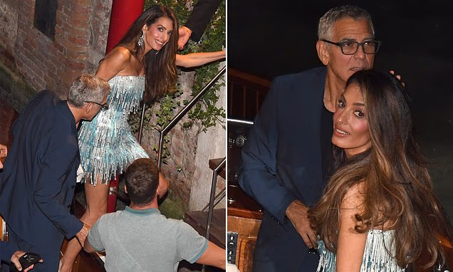 Amal Clooney wearing a sparkly turquoise fringed mini dress alongside George Clooney in Venice