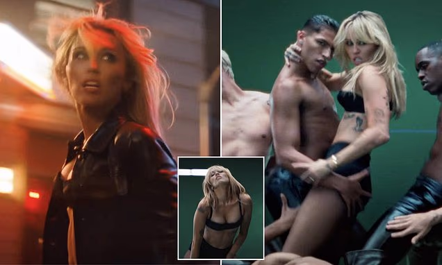 Miley Cyrus performing in a scene from her new music video