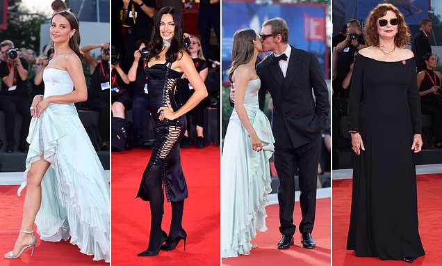 Alicia Vikander wearing a ruffled blue dress alongside husband Michael Fassbender on the red carpet