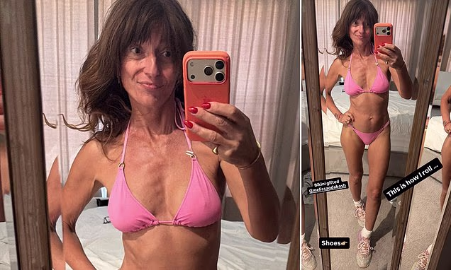 Davina McCall posing in a pink string bikini for an Instagram mirror selfie