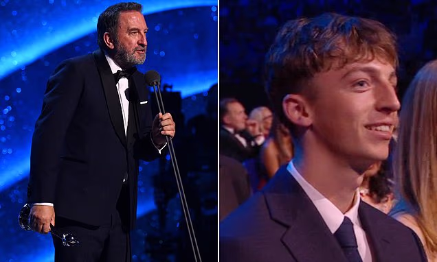 Lee Mack accepting an award at the National Television Awards