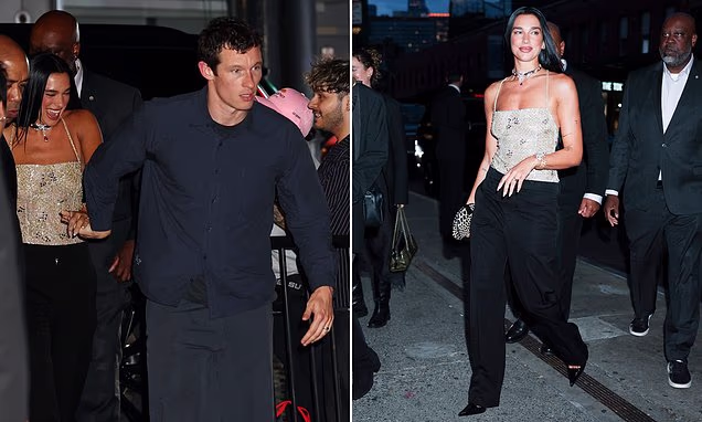 Dua Lipa and Callum Turner holding hands on a date night in New York City