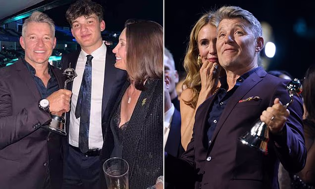 Ben Shephard posing with his award alongside his wife and son
