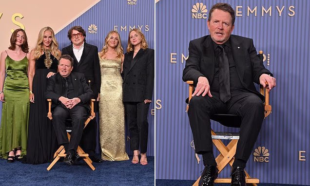 Michael J. Fox posing on a red carpet with his family