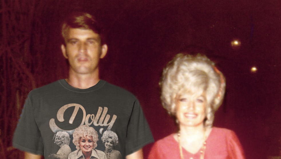 Carl Dean and Dolly Parton smiling together at a private event