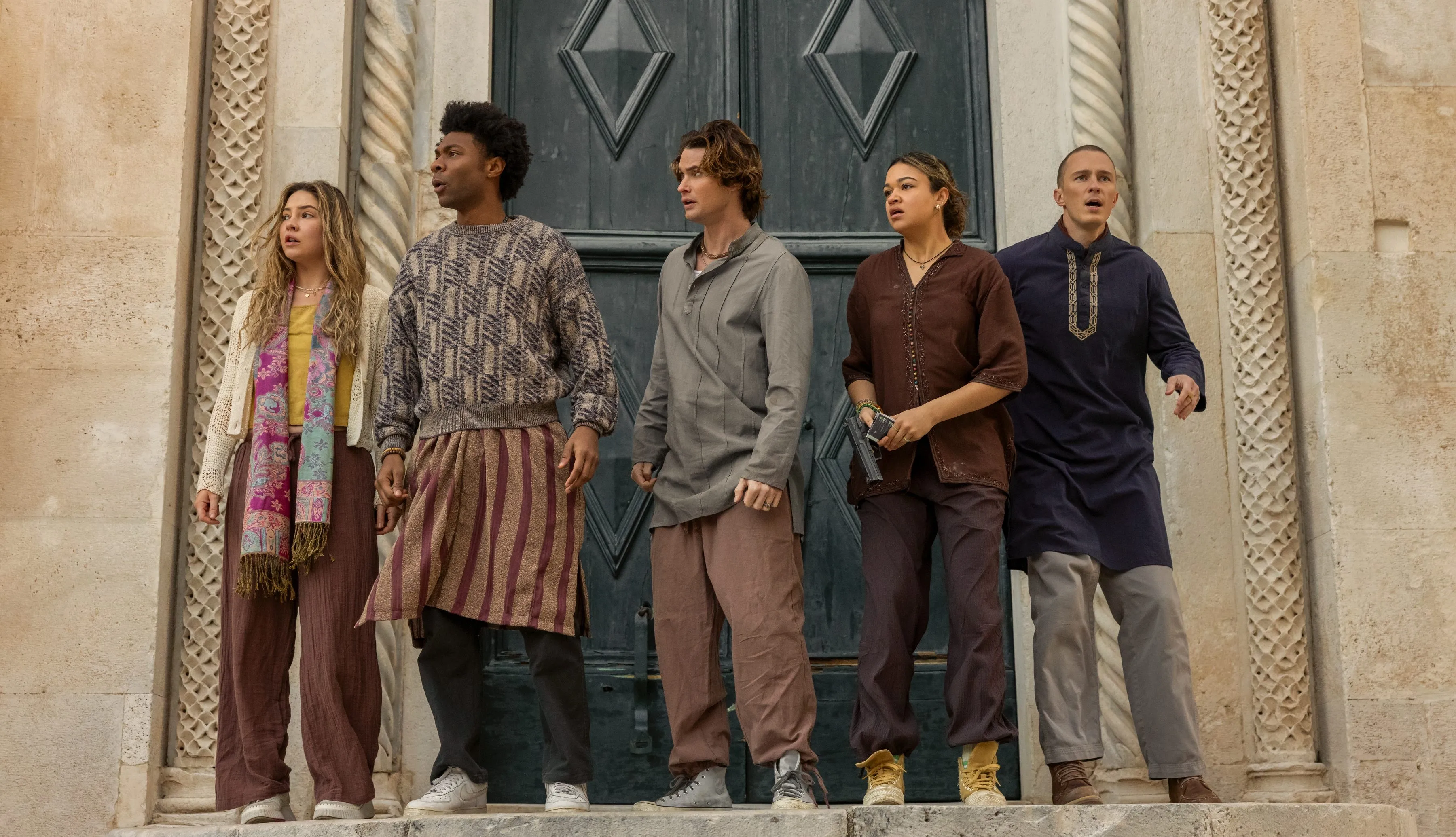 Outer Banks cast during a dramatic scene