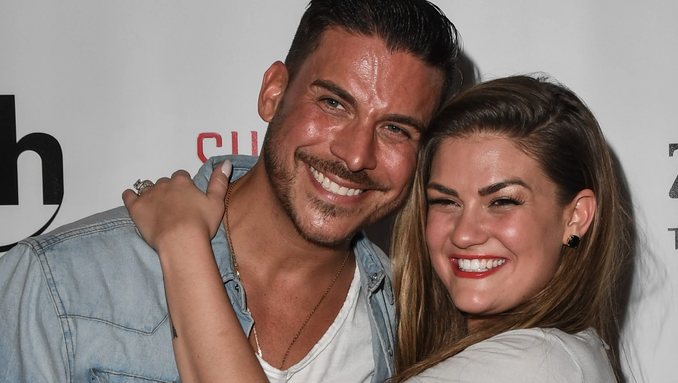 Jax Taylor and Brittany Cartwright posing together at an event