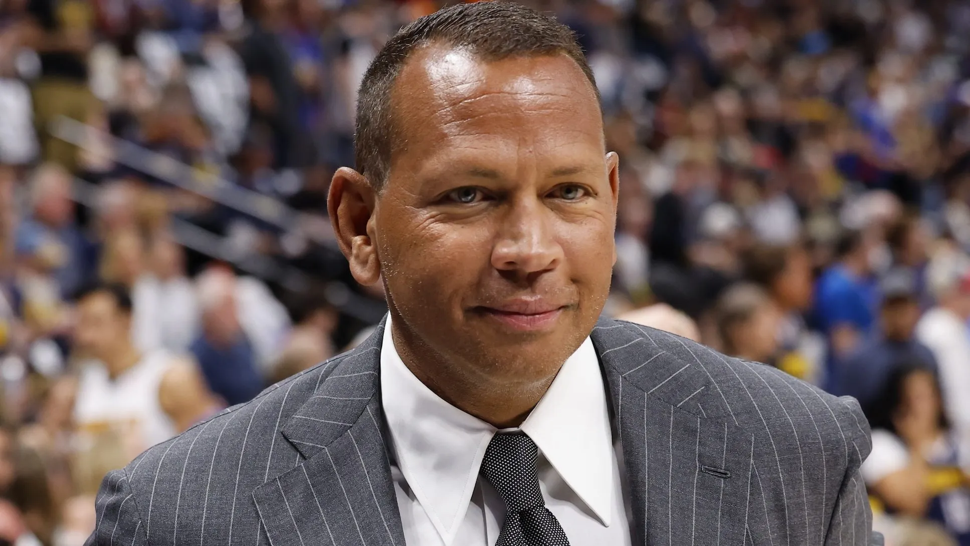 Alex Rodriguez attending a celebrity event in a dark suit