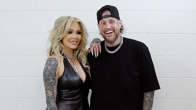 Bunnie Xo and Jelly Roll posing together at an event