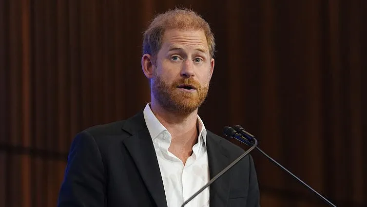 Prince Harry wearing a dark suit at a public engagement