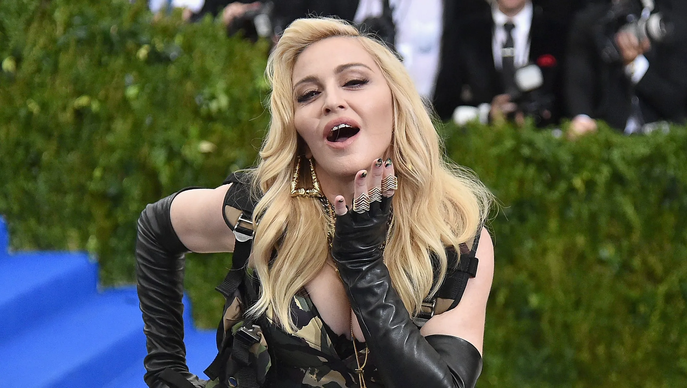 Madonna performing onstage during a concert tour