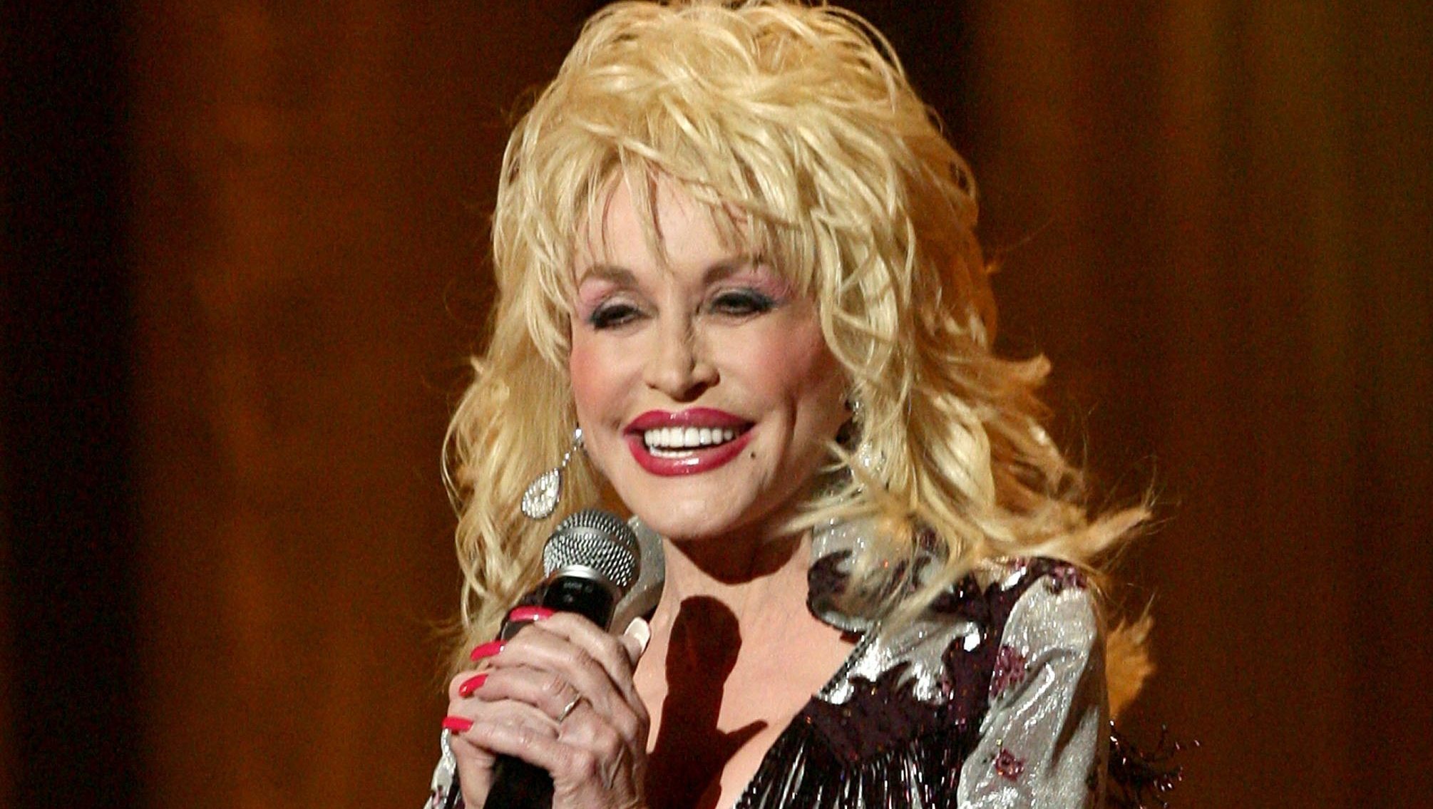 Country icon Dolly Parton smiling at an event