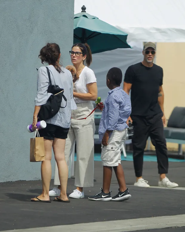 Sandra Bullock and her boyfriend Bryan Randall take their 2 years old rescued poodle to the pet store in West Hollywood in 2019 (FIA Pictures/MEGA)