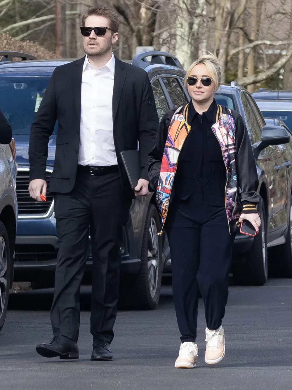 Hayden Panettiere arrives at her younger brother Jansen's celebration of life event in their hometown of Palisades, New York, with her on/off boyfriend Brian Hickerson. The grieving actress wore a colorful bomber jacket