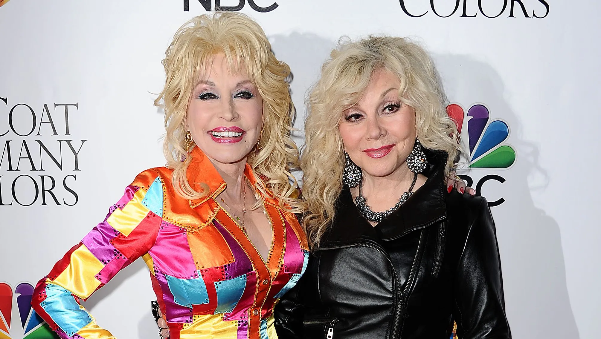 Country icon Dolly Parton smiling at a red carpet event