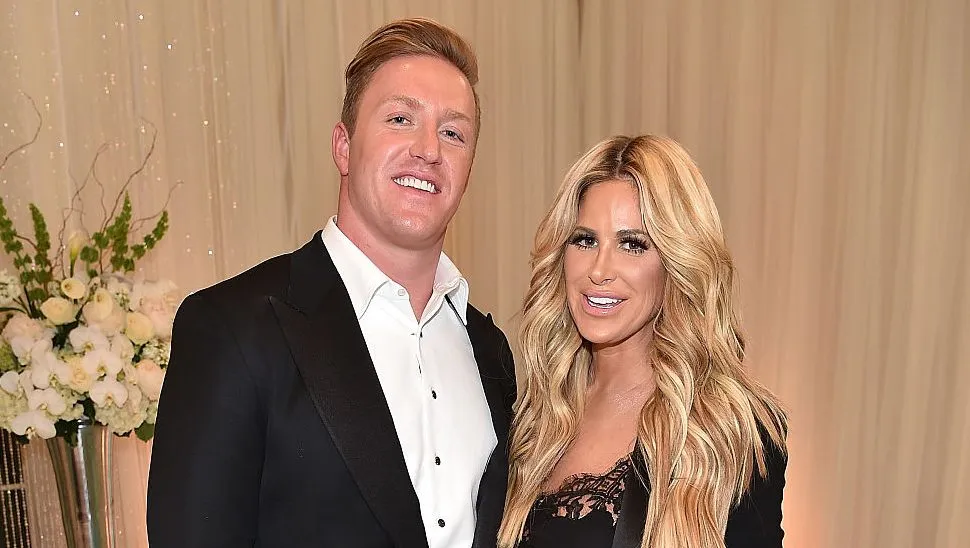 Kim Zolciak posing at a reality television event.