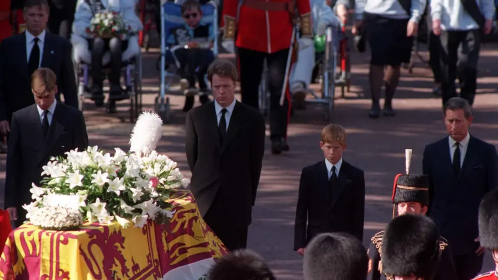 Princes William, Earl Spencer, Prince Harry and the then Prince of Wales, walking behind Princess Diana's coffin as the funeral procession approaches Westminster Abbey in September 1997