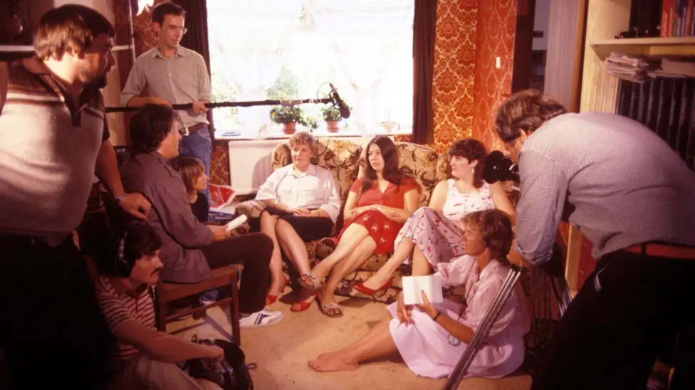 A behind-the-scenes shot of Jackie, Lynne and Sue filming 28 Up.