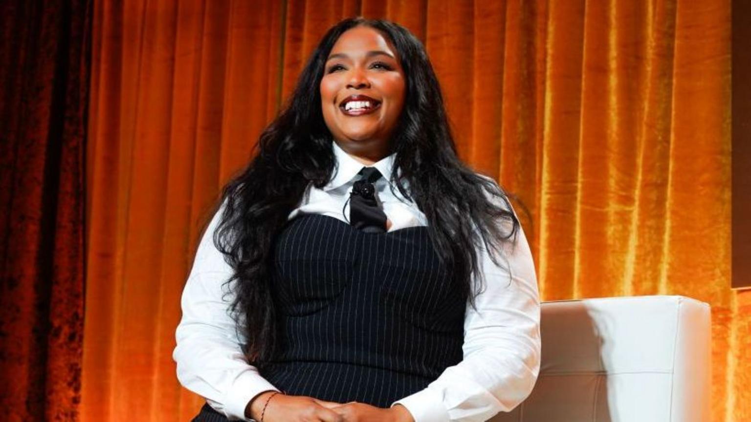 Lizzo posing at a public red carpet event.