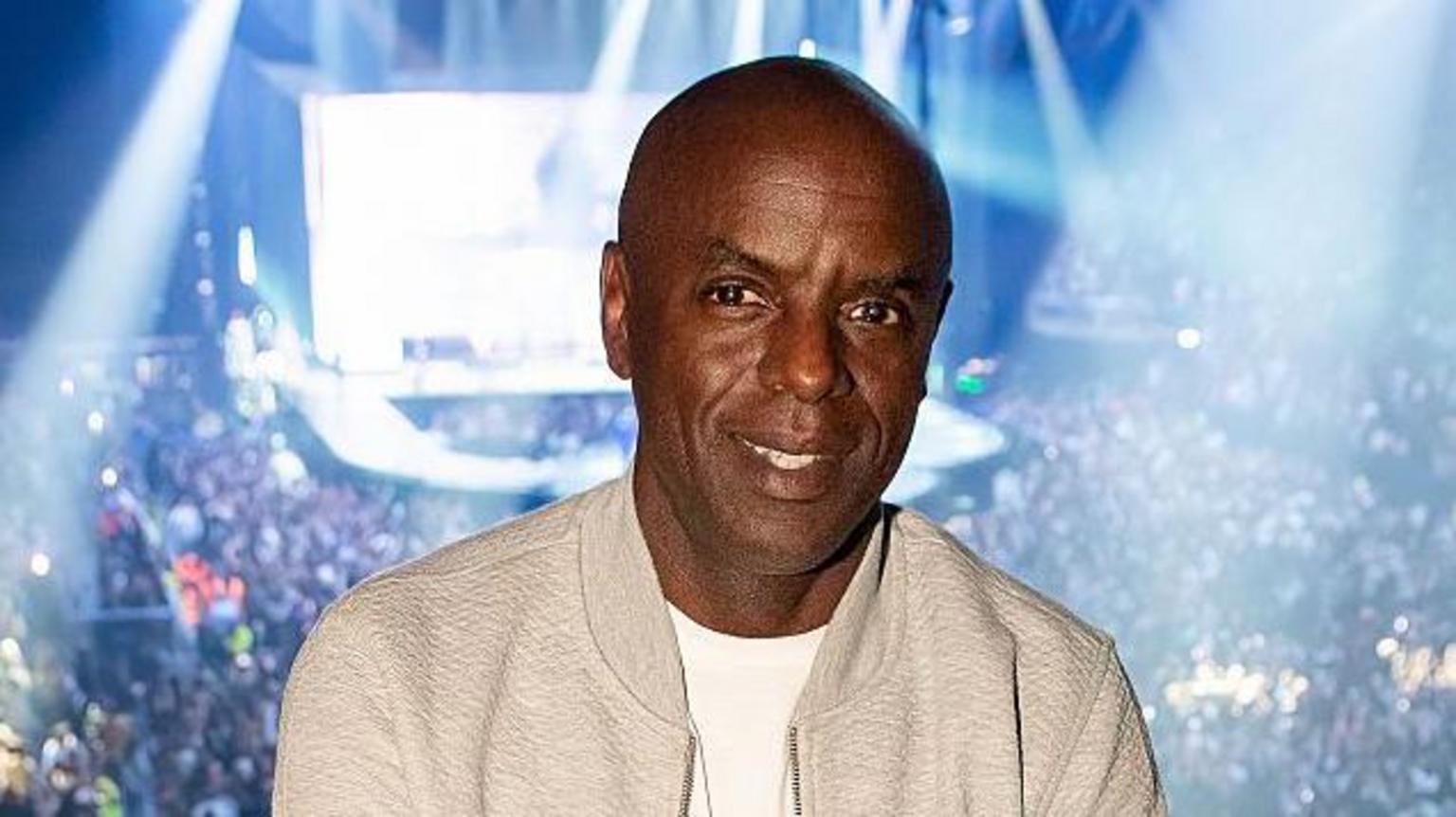 Trevor Nelson posing at a radio broadcast event