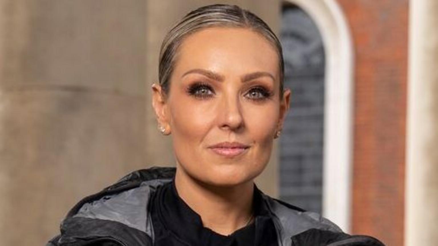 Amy Dowden smiling on set after taking part in Celebrity Hunted