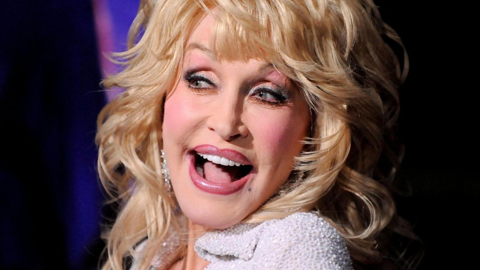 Country music star Dolly Parton smiling at a public appearance