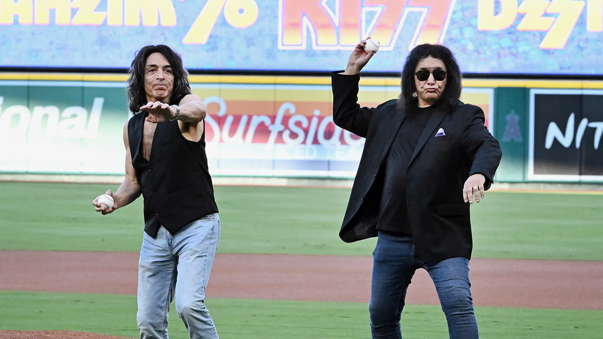 Gene Simmons throwing a ceremonial pitch on the baseball field