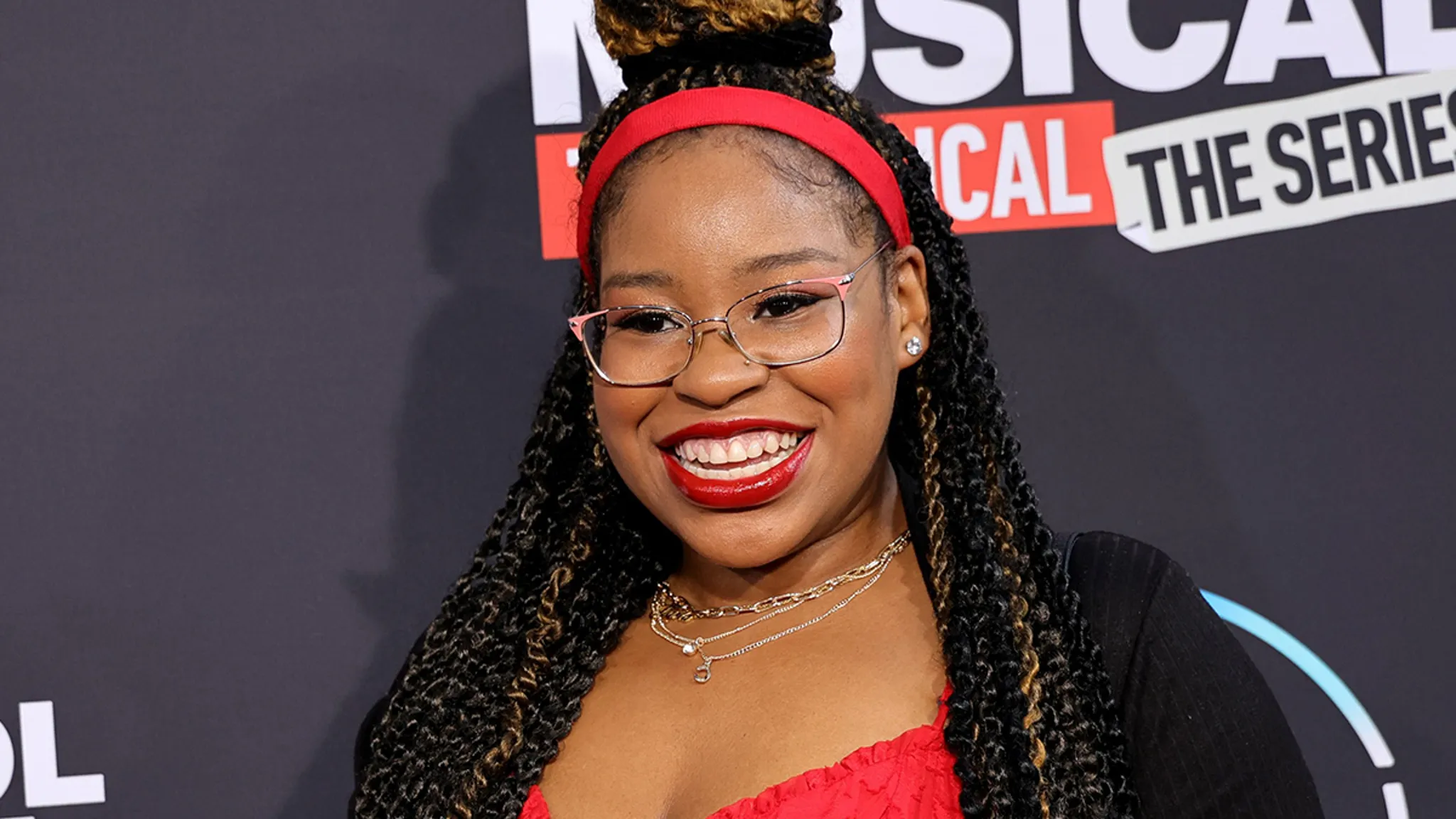 Carla Jeffery smiling on a red carpet