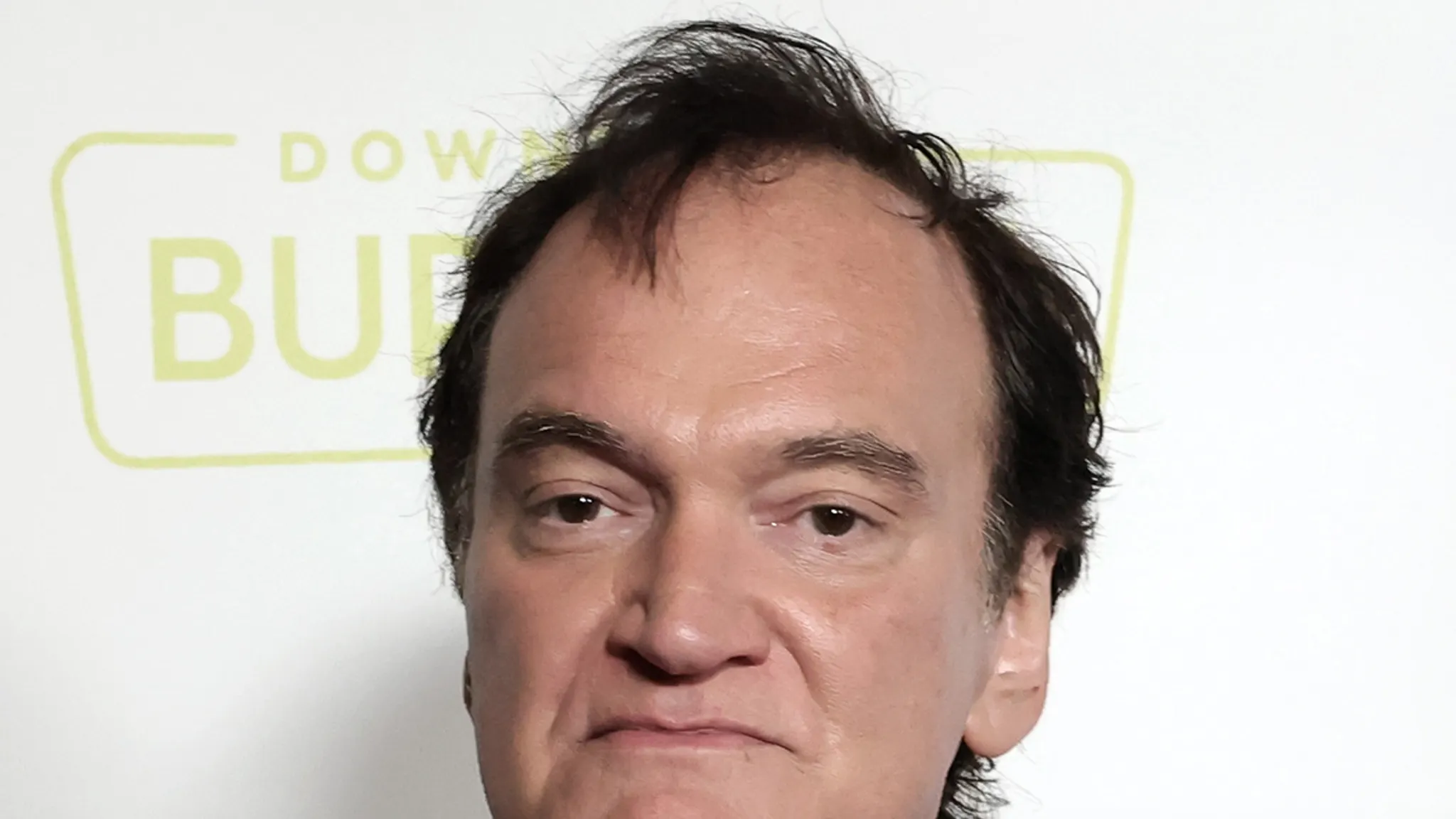 Quentin Tarantino attending a film premiere on the red carpet