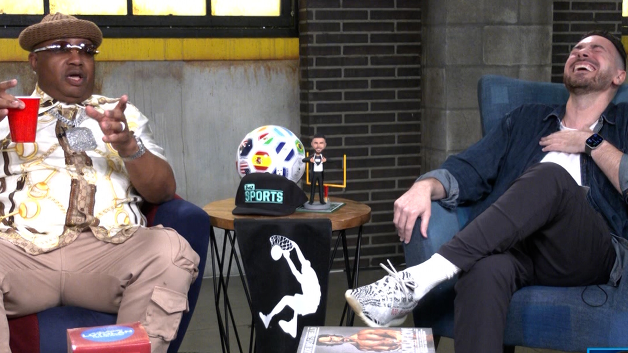 E-40 smiling during a newsroom interview