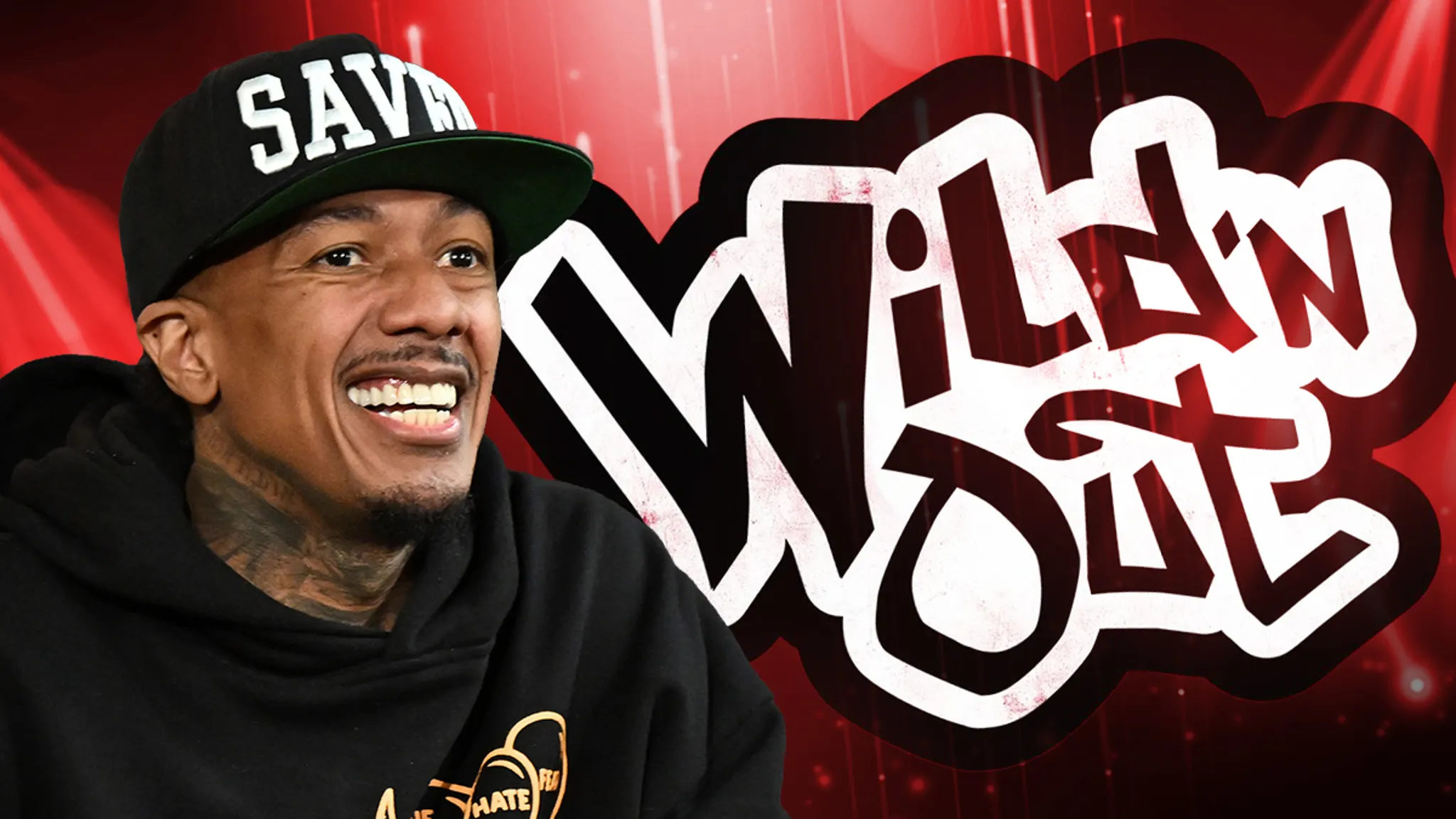 Nick Cannon hosting Wild N Out on stage in front of a crowd