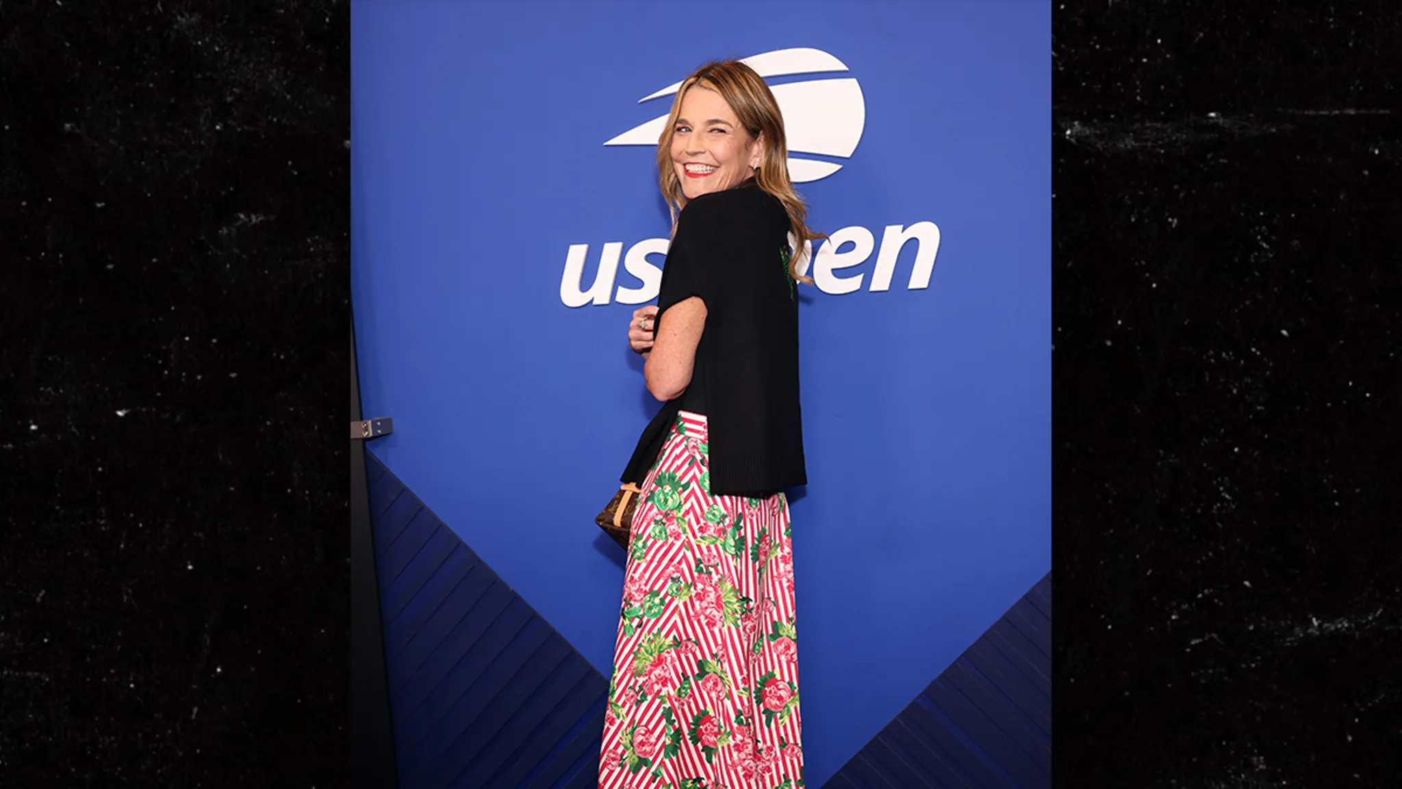 Savannah Guthrie smiling at the U.S. Open with husband Michael Feldman