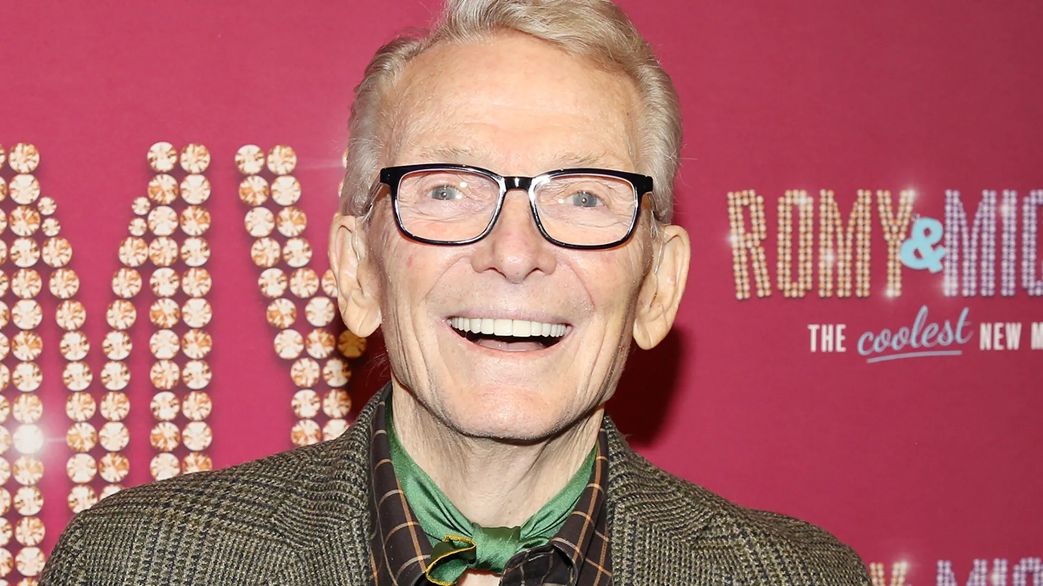 Fashion designer Bob Mackie posing at a Hollywood red carpet event