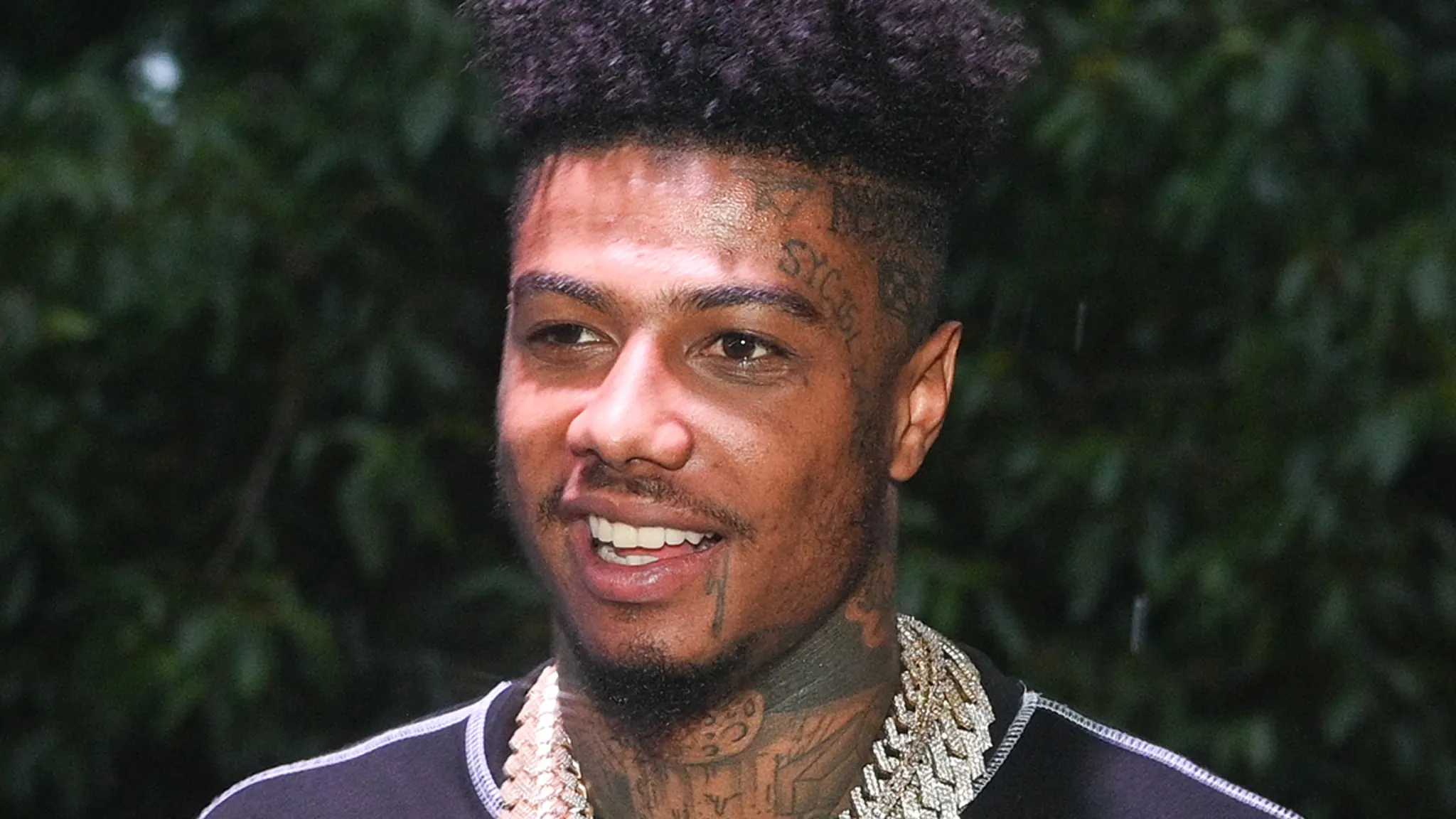 Rapper Blueface posing at a showbiz event