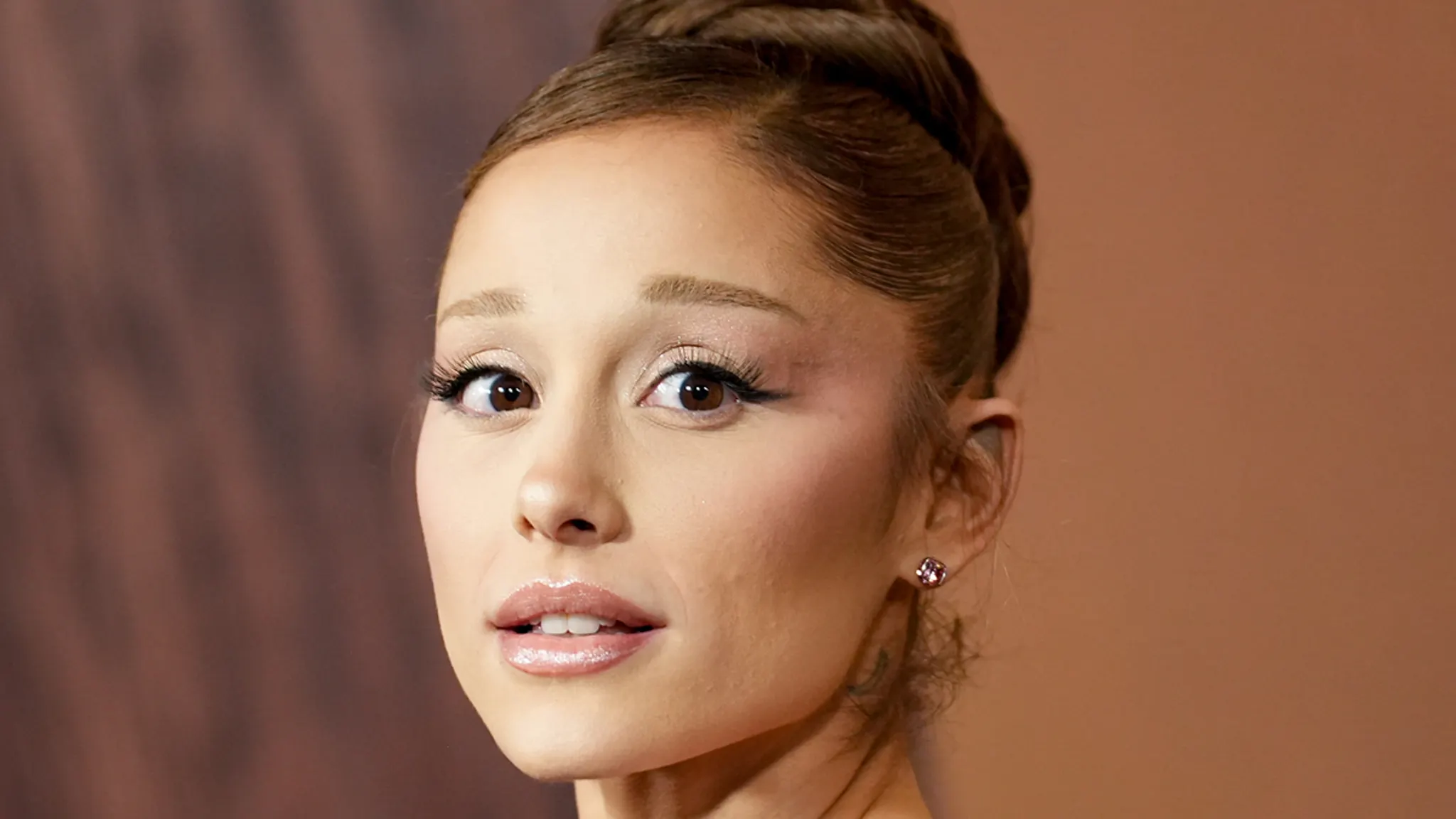 Ariana Grande attending a high-profile movie premiere on the red carpet